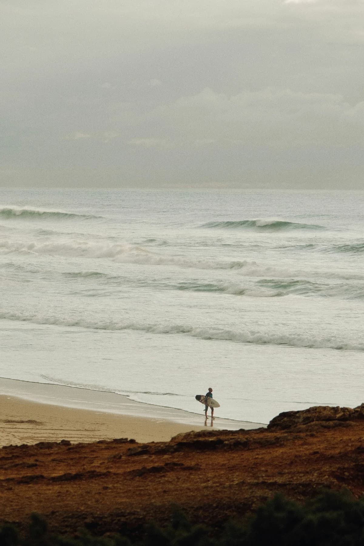 Surfer checking waves at Praia do Guincho